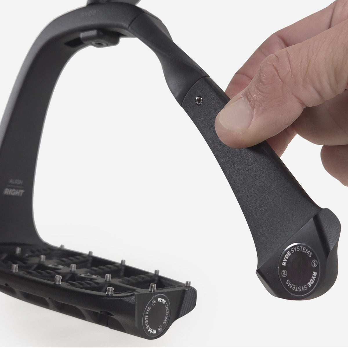 Opening the safety release on a RYDE Align stirrup
